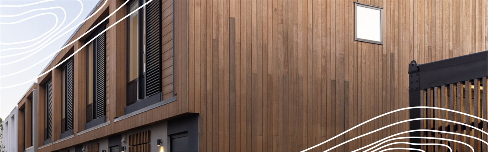 Building clad in vertical hardwood boards