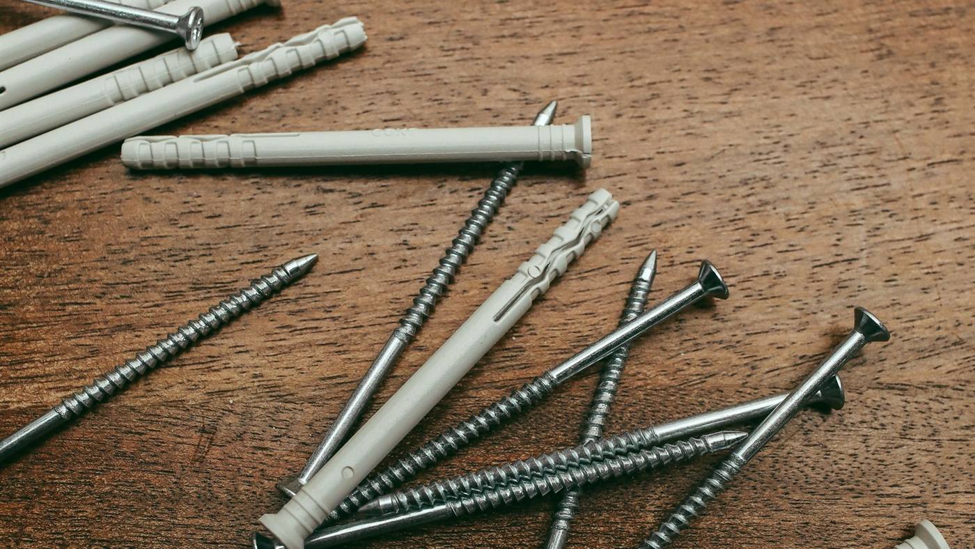 Timber screws and fixings on a hardwood surface